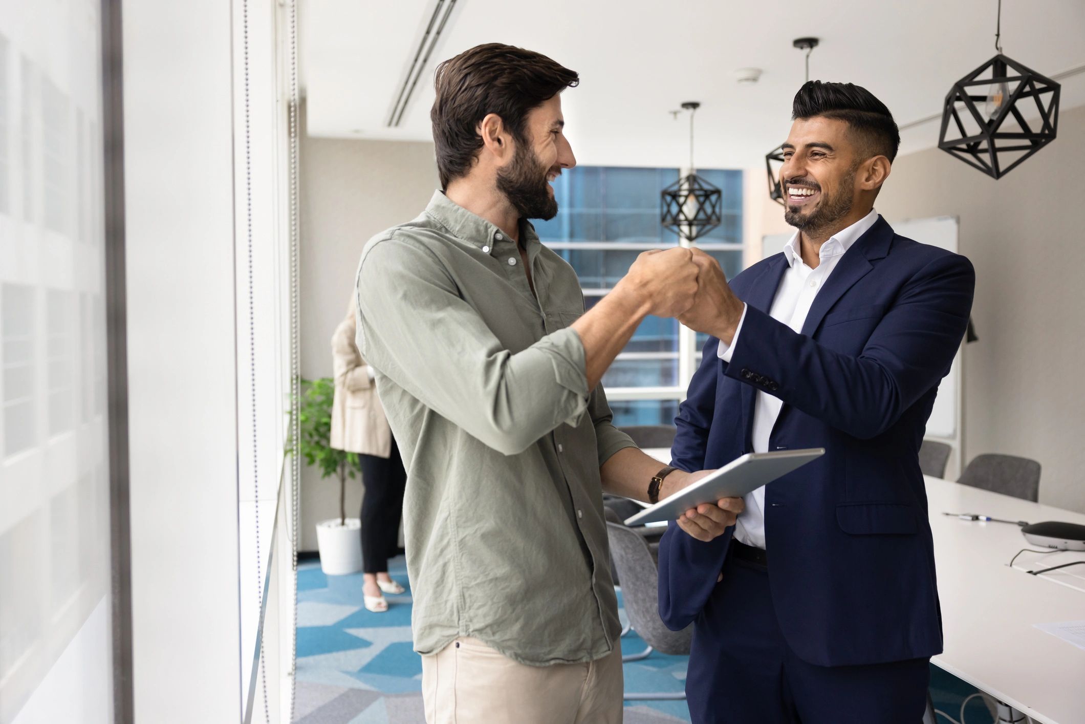 Two professionals celebrating a successful deal